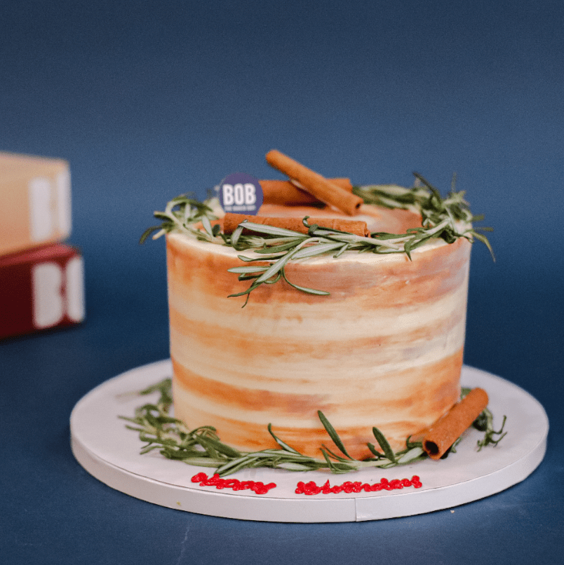 Brown Accent Cake with Rosemary and Cinnamon Logs